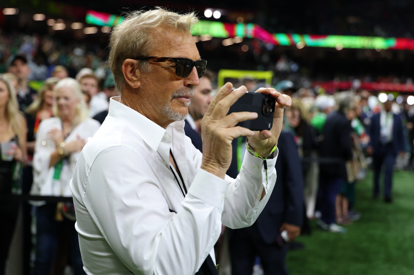 What was Kimberly Guilfoyle doing with Kevin Costner at the Super Bowl?