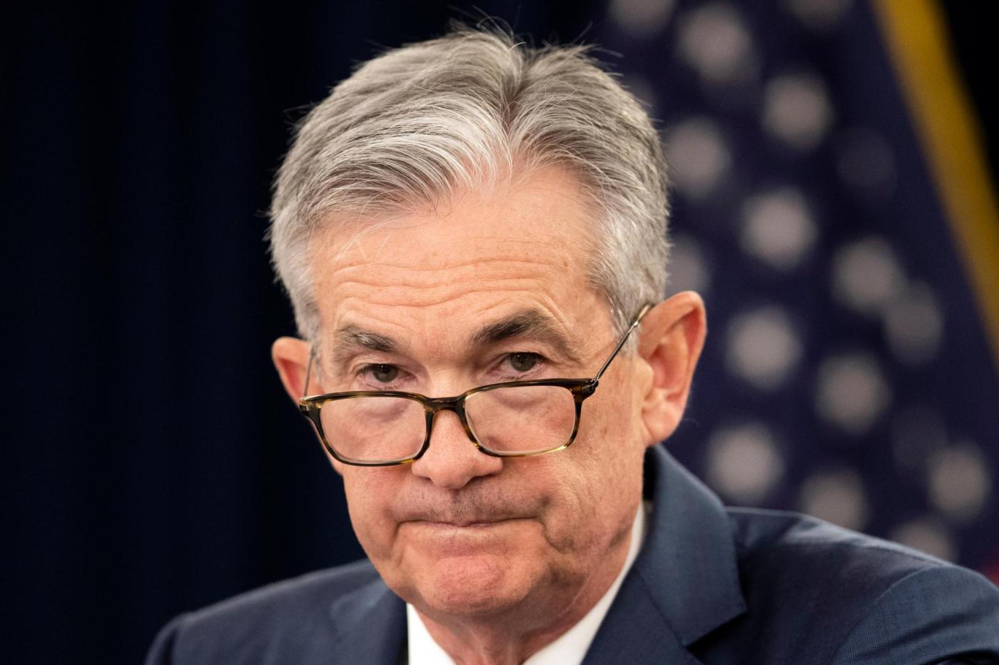 Federal Reserve leaves key rate unchanged, flags a risk of higher prices and unemployment