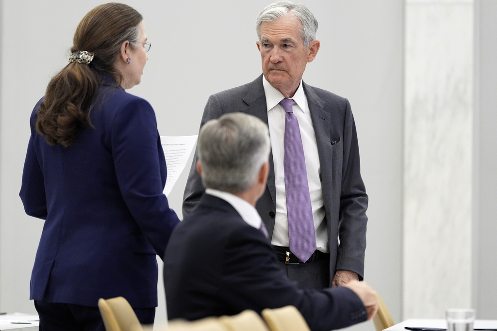 Federal Reserve leaves its key rate unchanged but sees two cuts this year
