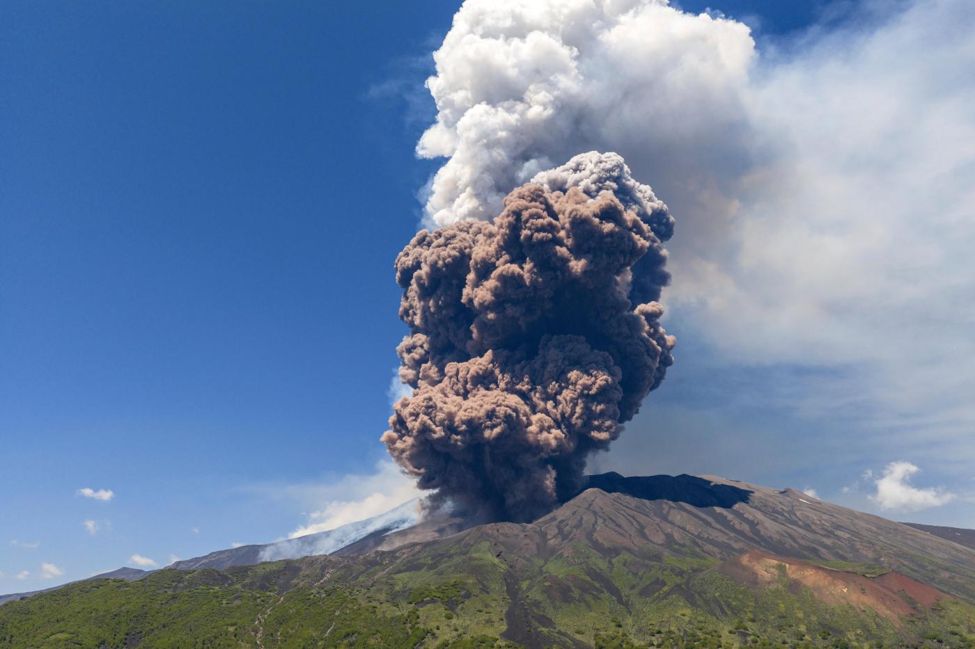 Sicily’s Mount Etna erupts in a fiery show of smoke and ash miles high