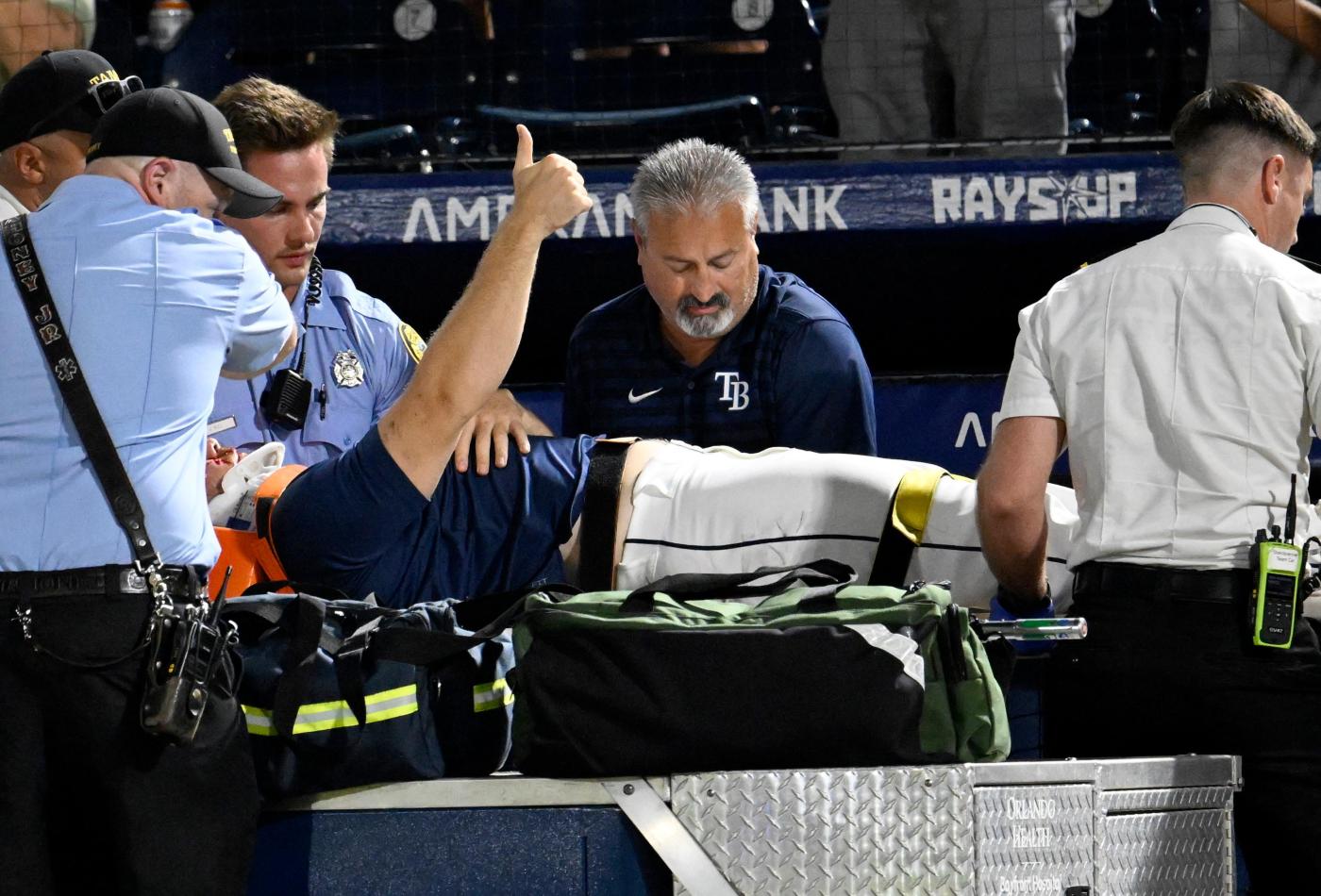 Rays pitcher carted off field and taken to hospital after foul ball into dugout hits him in face