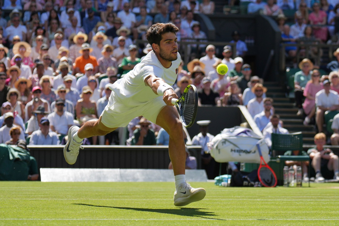Two-time defending champion Carlos Alcaraz beats Taylor Fritz to reach the Wimbledon final