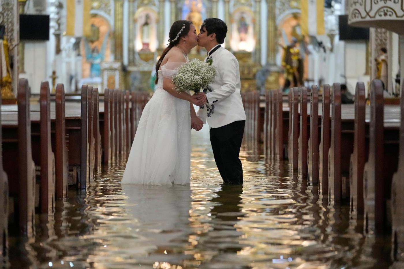 Photos: Filipino couple marry in typhoon-flooded church