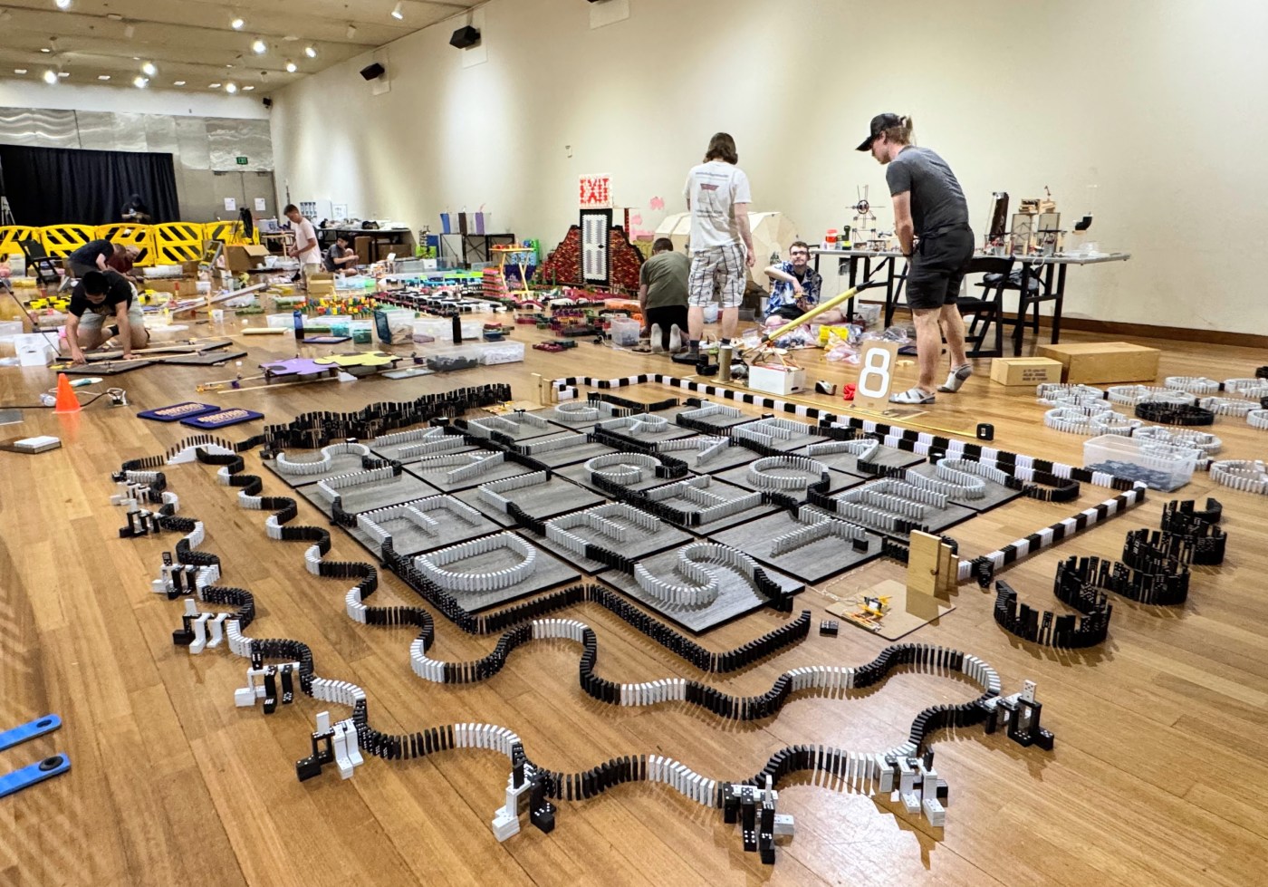 Domino masters get everything in place for the Tech Topple in San Jose