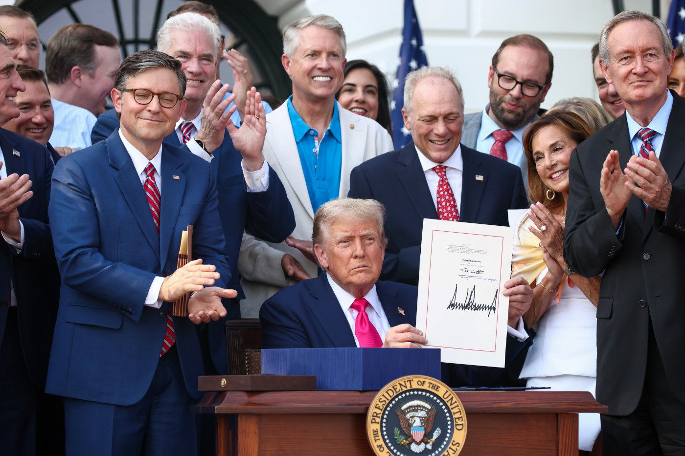 At July 4 celebration, Trump signs tax and spending cut bill