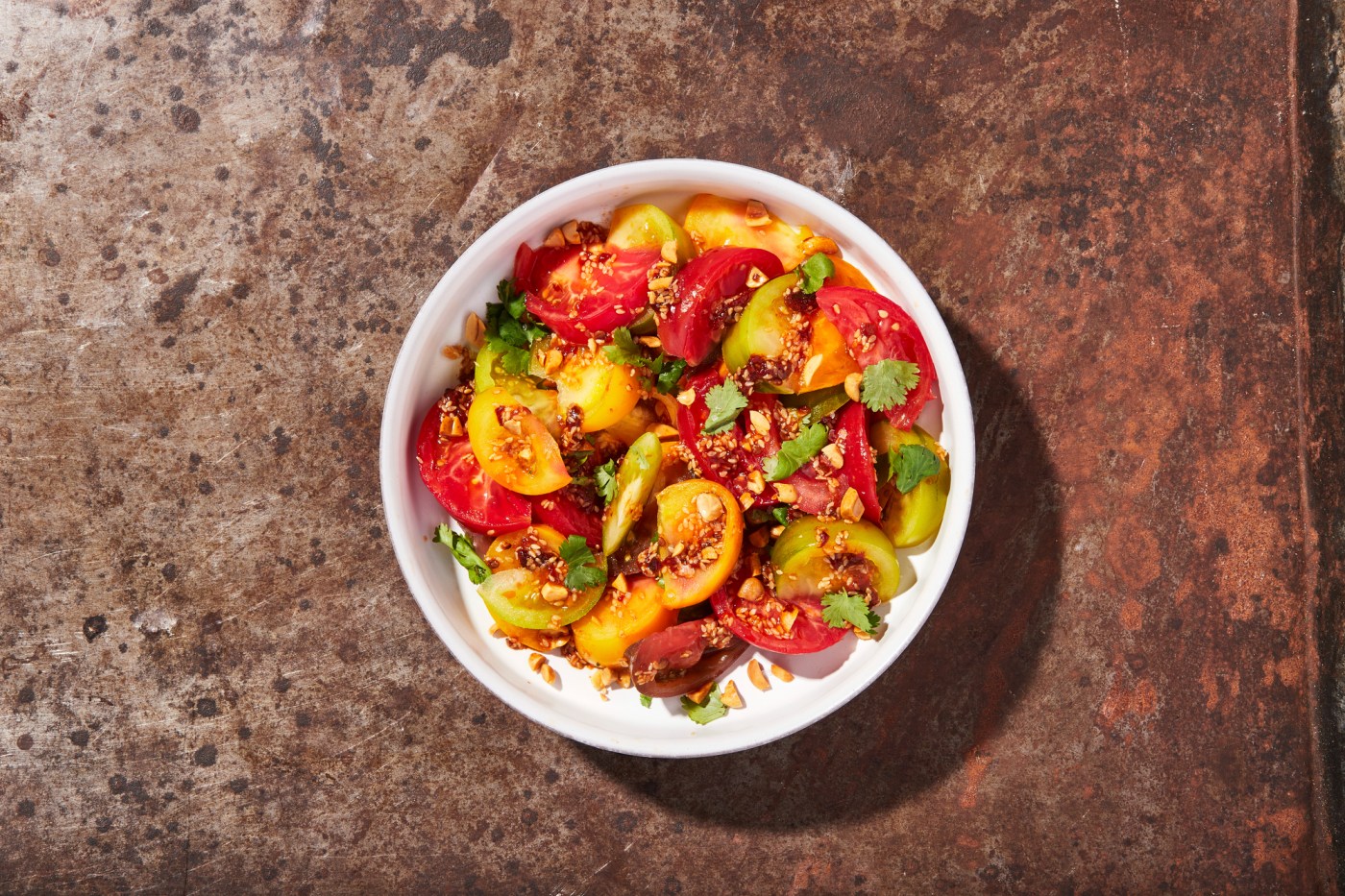 Savory-spicy peanut dressing complements tomato’s sweetness
