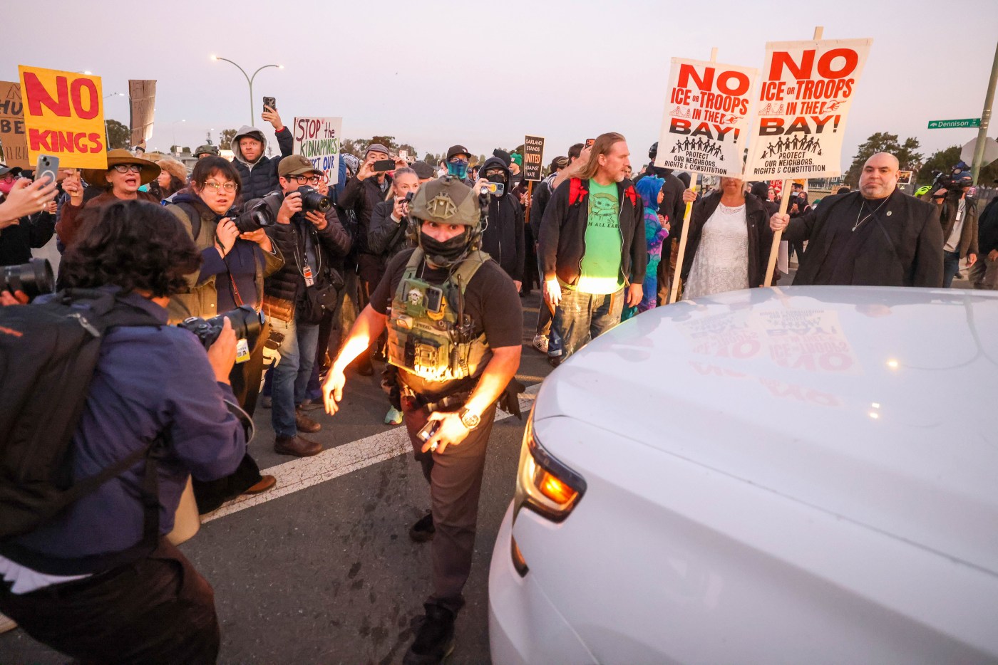 Photos:  Protesters clash with federal agents outside Coast Guard Island as immigration enforcement descends on Bay Area