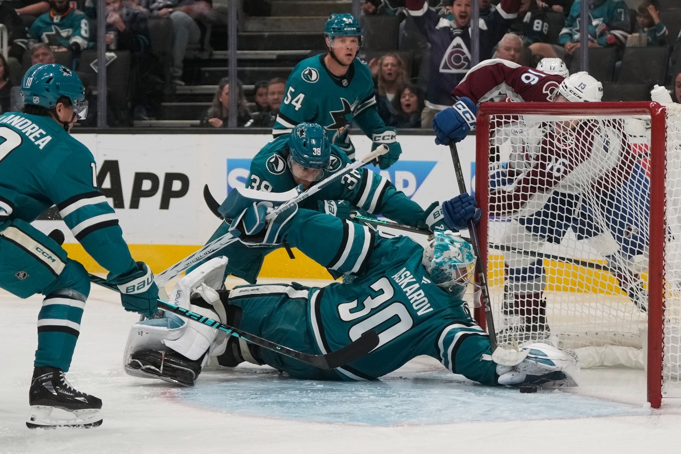 Sharks beat Avalanche in OT, lose defenseman to injury